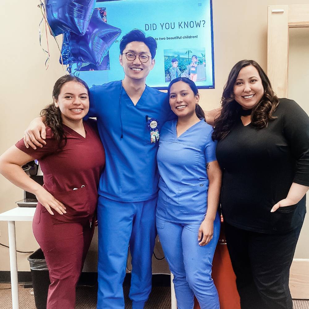 Dr. Andrew Choi and some of his team members posing for a photo at Inland Choice Dental.